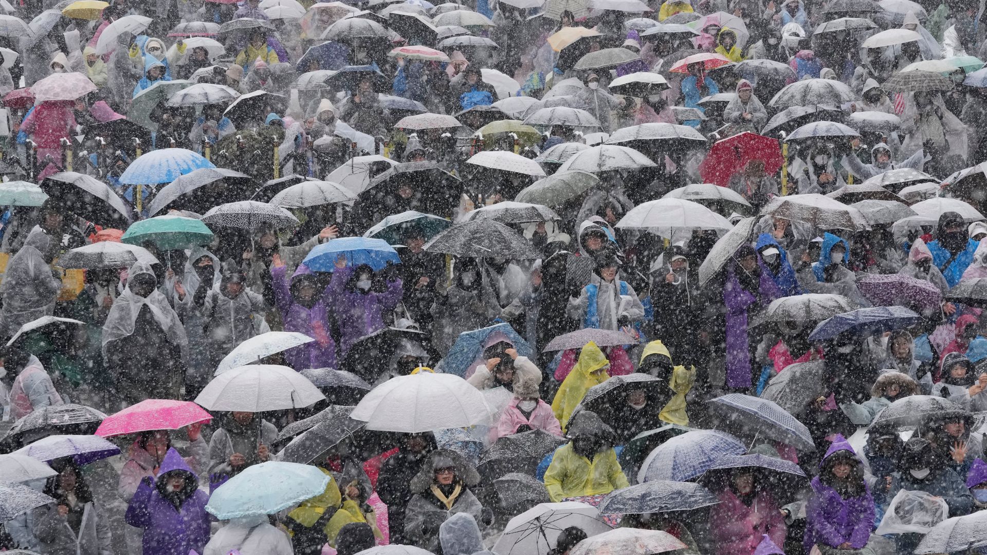 Thousands brave freezing conditions to protest against South Korean president as he faces arrest